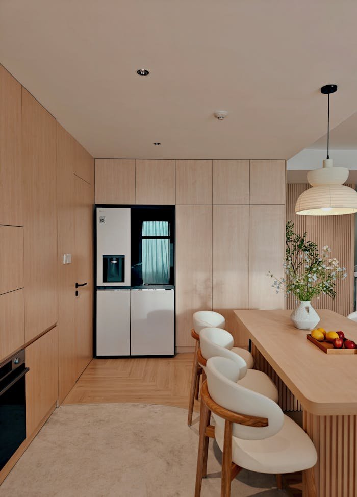 Stylish and minimalist kitchen interior with wooden finish and elegant decor in Vietnam.